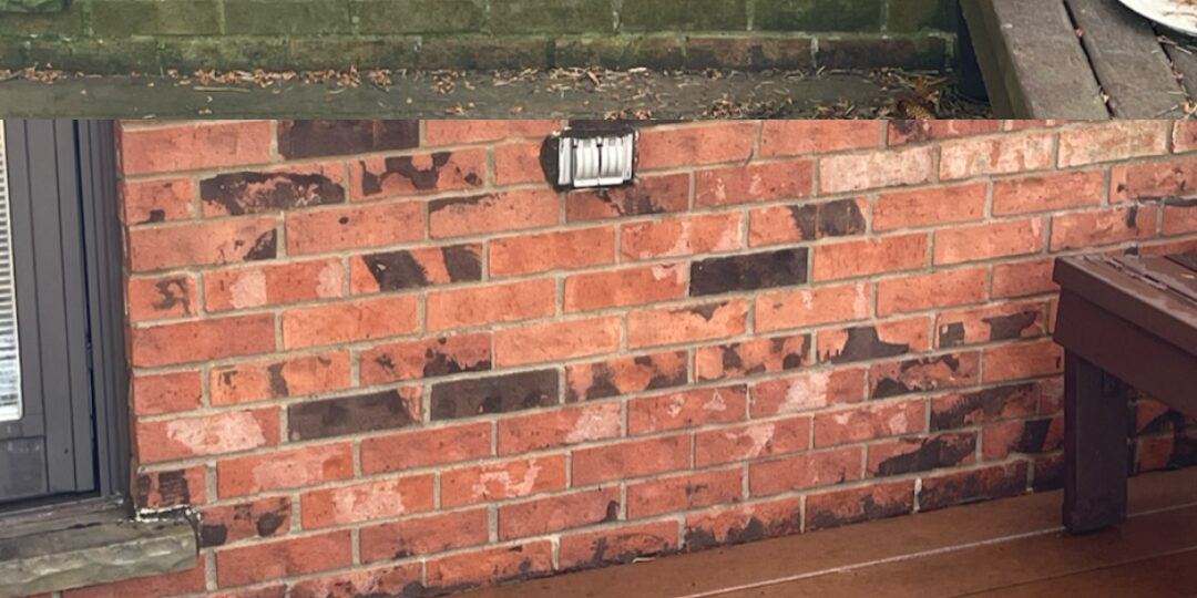 Brick by the sliding door after power washing