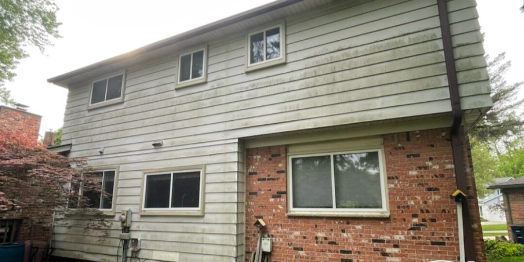 Second-story siding before power washing
